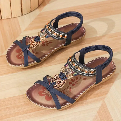 Clara | Elegant sandals decorated with flowers and a rhinestone butterfly